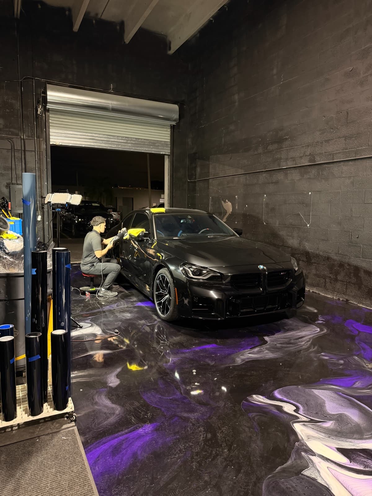 BMW being ceramic tinted inside Dr. Tints Miami shop