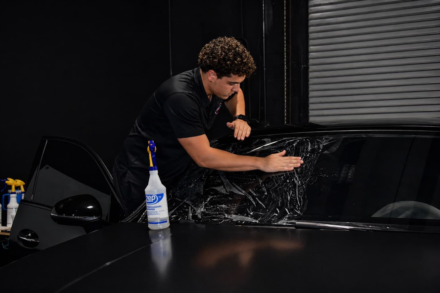 Professional window film installation — Dr. Tints Miami technician applying ceramic film